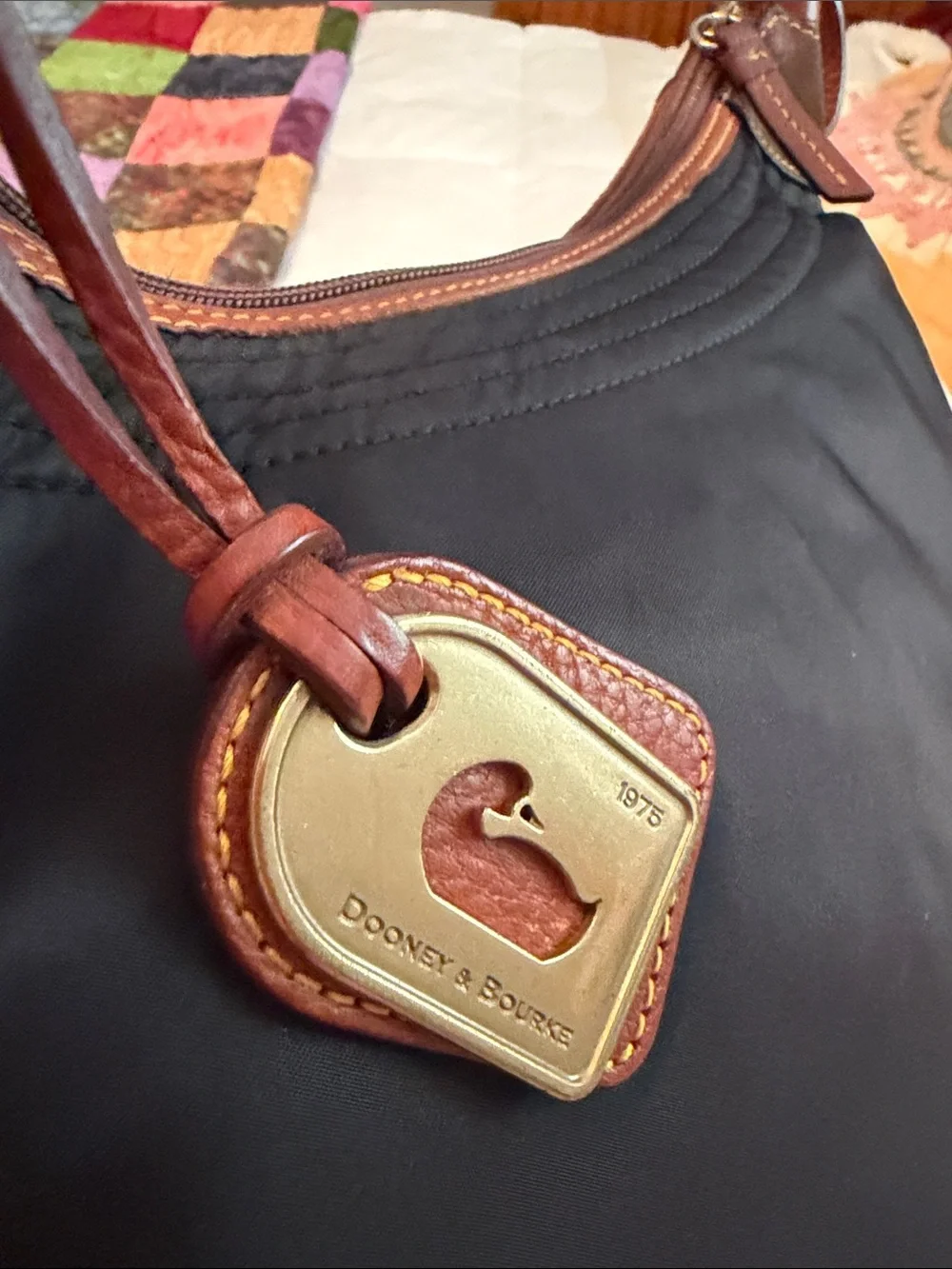 Dooney & Bourke large Erika black nylon quilted shoulder bag with tan leather